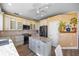 Spacious kitchen with granite countertops, stainless steel appliances, and white cabinets at 1613 Sand Key Estates Ct, Clearwater, FL 33767