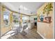 Bright kitchen with granite island and painted mural at 1613 Sand Key Estates Ct, Clearwater, FL 33767