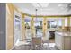 Eat-in kitchen with water views and granite countertops at 1613 Sand Key Estates Ct, Clearwater, FL 33767