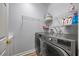 Laundry room with LG washer and dryer and shelving at 1613 Sand Key Estates Ct, Clearwater, FL 33767
