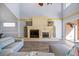 Spacious living room with a stone fireplace and hardwood floors at 1613 Sand Key Estates Ct, Clearwater, FL 33767