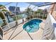 Enclosed pool with water view at 1613 Sand Key Estates Ct, Clearwater, FL 33767