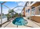 Kidney shaped pool with water view at 1613 Sand Key Estates Ct, Clearwater, FL 33767
