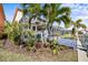 Landscaped waterfront property with private dock at 1613 Sand Key Estates Ct, Clearwater, FL 33767