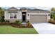 Attractive one-story home with a two-car garage and landscaped front yard at 18216 Beach Ranch Ter, Lakewood Ranch, FL 34211
