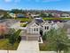 Two-story home with solar panels and a large yard at 19354 Yellow Clover Dr, Tampa, FL 33647