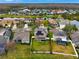 Aerial view of a house with solar panels and a fenced backyard at 19354 Yellow Clover Dr, Tampa, FL 33647