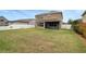 House backyard view with green lawn at 19354 Yellow Clover Dr, Tampa, FL 33647