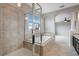 Spa-like bathroom with a large walk-in shower and soaking tub at 19354 Yellow Clover Dr, Tampa, FL 33647