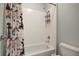 Clean bathroom with shower/tub combo and patterned shower curtain at 19354 Yellow Clover Dr, Tampa, FL 33647