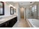 Bathroom boasts double sinks, a large soaking tub, and a walk-in shower at 19354 Yellow Clover Dr, Tampa, FL 33647