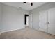 Bright bedroom with double doors and access to another room at 19354 Yellow Clover Dr, Tampa, FL 33647