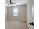 Spacious bedroom with window, ceiling fan and carpet at 19354 Yellow Clover Dr, Tampa, FL 33647