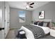 Bright bedroom with a ceiling fan, window, and double door closet at 19354 Yellow Clover Dr, Tampa, FL 33647