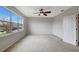 Bright bedroom with large windows, ceiling fan and neutral decor at 19354 Yellow Clover Dr, Tampa, FL 33647