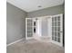 Bright bedroom with French doors leading to another room at 19354 Yellow Clover Dr, Tampa, FL 33647