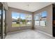 Breakfast nook with large windows offering a view of the backyard at 19354 Yellow Clover Dr, Tampa, FL 33647