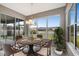 Sunlit breakfast nook showcasing backyard views and seating for four at 19354 Yellow Clover Dr, Tampa, FL 33647