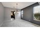 Neutral-toned dining room with an archway to kitchen at 19354 Yellow Clover Dr, Tampa, FL 33647