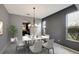 Bright dining room features a modern chandelier and hardwood floors at 19354 Yellow Clover Dr, Tampa, FL 33647