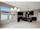Open kitchen with breakfast nook and view of backyard at 19354 Yellow Clover Dr, Tampa, FL 33647