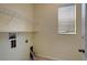 Laundry room includes shelving and window for natural light at 19354 Yellow Clover Dr, Tampa, FL 33647