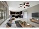 Open concept living room with kitchen and tile floors at 19354 Yellow Clover Dr, Tampa, FL 33647