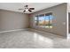 Bright living room with tile floors and backyard view at 19354 Yellow Clover Dr, Tampa, FL 33647