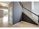 Elegant staircase with black and white railings adds a touch of sophistication at 19354 Yellow Clover Dr, Tampa, FL 33647