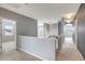 Upstairs hallway with neutral paint and plush carpeting at 19354 Yellow Clover Dr, Tampa, FL 33647