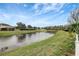 Peaceful waterfront view with pond and lush greenery at 19354 Yellow Clover Dr, Tampa, FL 33647