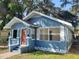 Newly painted blue house with a red door and a small front yard at 2035 11Th S St, St Petersburg, FL 33705