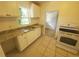 Kitchen with white cabinets, granite countertops, and a stove at 2035 11Th S St, St Petersburg, FL 33705