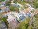 Aerial view of neighborhood, highlighting a house with a pool at 2071 Otter Way, Palm Harbor, FL 34685