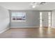 Spacious living room featuring a large window and wood-look floors at 2349 Grandin St, Holiday, FL 34690