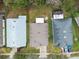 Overhead view of three houses nestled in a residential neighborhood at 25406 Lexington Oaks Blvd, Wesley Chapel, FL 33544