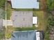 Top-down view of a single-Gathering home with a gray roof and a small backyard at 25406 Lexington Oaks Blvd, Wesley Chapel, FL 33544