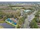 Aerial view of community amenities including pool, playground, and clubhouse at 25406 Lexington Oaks Blvd, Wesley Chapel, FL 33544