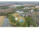 Aerial view showing community pool, sports courts, and a lake at 25406 Lexington Oaks Blvd, Wesley Chapel, FL 33544
