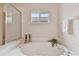 Relaxing bathroom with garden tub and glass shower at 25406 Lexington Oaks Blvd, Wesley Chapel, FL 33544