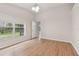 Well-lit bedroom with wood flooring and backyard view at 25406 Lexington Oaks Blvd, Wesley Chapel, FL 33544