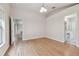 Bright bedroom with wood-look floors and access to bathroom at 25406 Lexington Oaks Blvd, Wesley Chapel, FL 33544