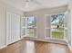 Bedroom with wood flooring and large windows at 25406 Lexington Oaks Blvd, Wesley Chapel, FL 33544