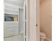 Spacious closet with shelves and adjacent toilet at 25406 Lexington Oaks Blvd, Wesley Chapel, FL 33544