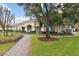 Community clubhouse with landscaping and walkway at 25406 Lexington Oaks Blvd, Wesley Chapel, FL 33544