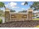 Community center sign with stone pillars and landscaping at 25406 Lexington Oaks Blvd, Wesley Chapel, FL 33544