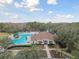 Resort-style pool with clubhouse and lush landscaping at 25406 Lexington Oaks Blvd, Wesley Chapel, FL 33544