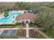 Resort-style community pool with a clubhouse and playground at 25406 Lexington Oaks Blvd, Wesley Chapel, FL 33544