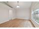 Simple dining room with light wood flooring and large windows at 25406 Lexington Oaks Blvd, Wesley Chapel, FL 33544