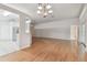 Light-filled dining room with hardwood floors and chandelier at 25406 Lexington Oaks Blvd, Wesley Chapel, FL 33544